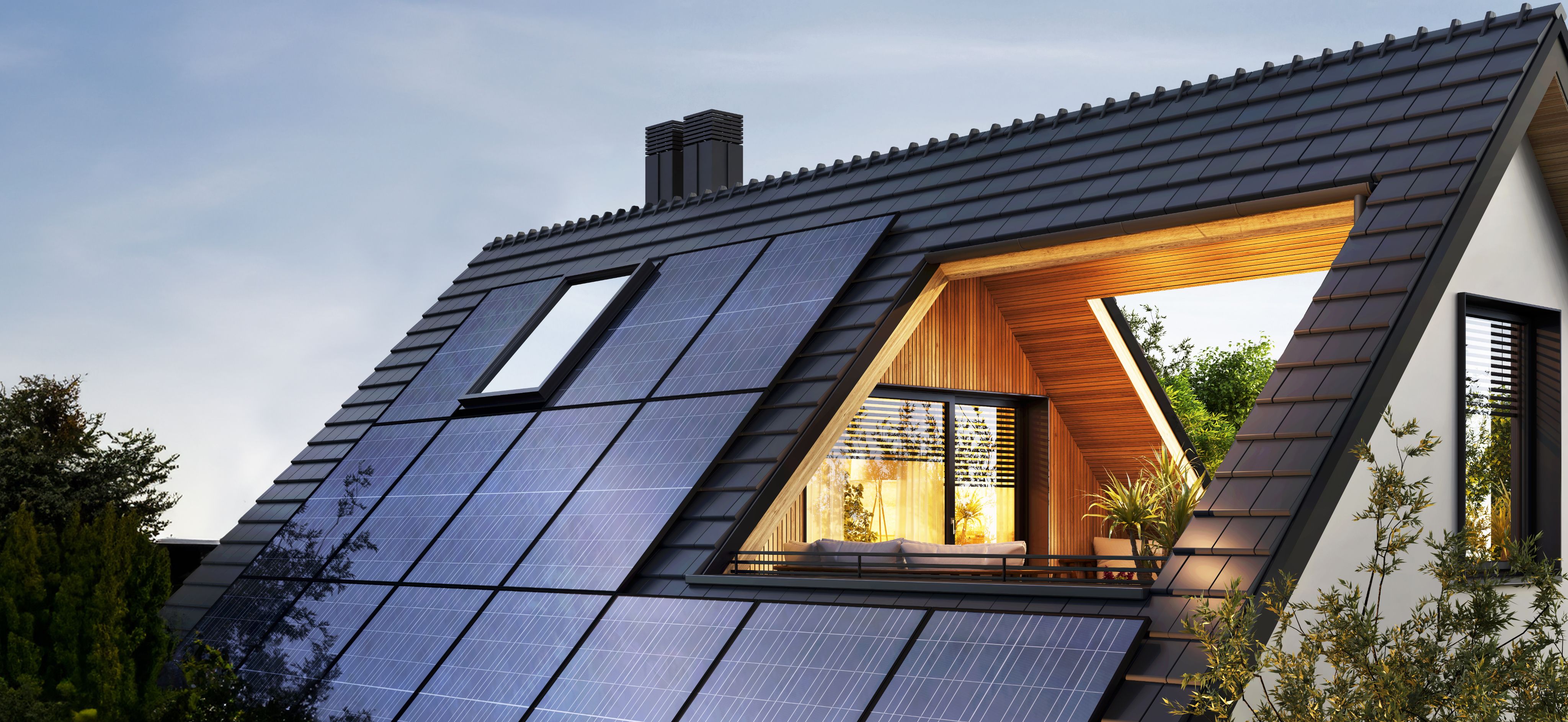 Ein Haus mit Solarzellen und integrierter Dachterrasse.